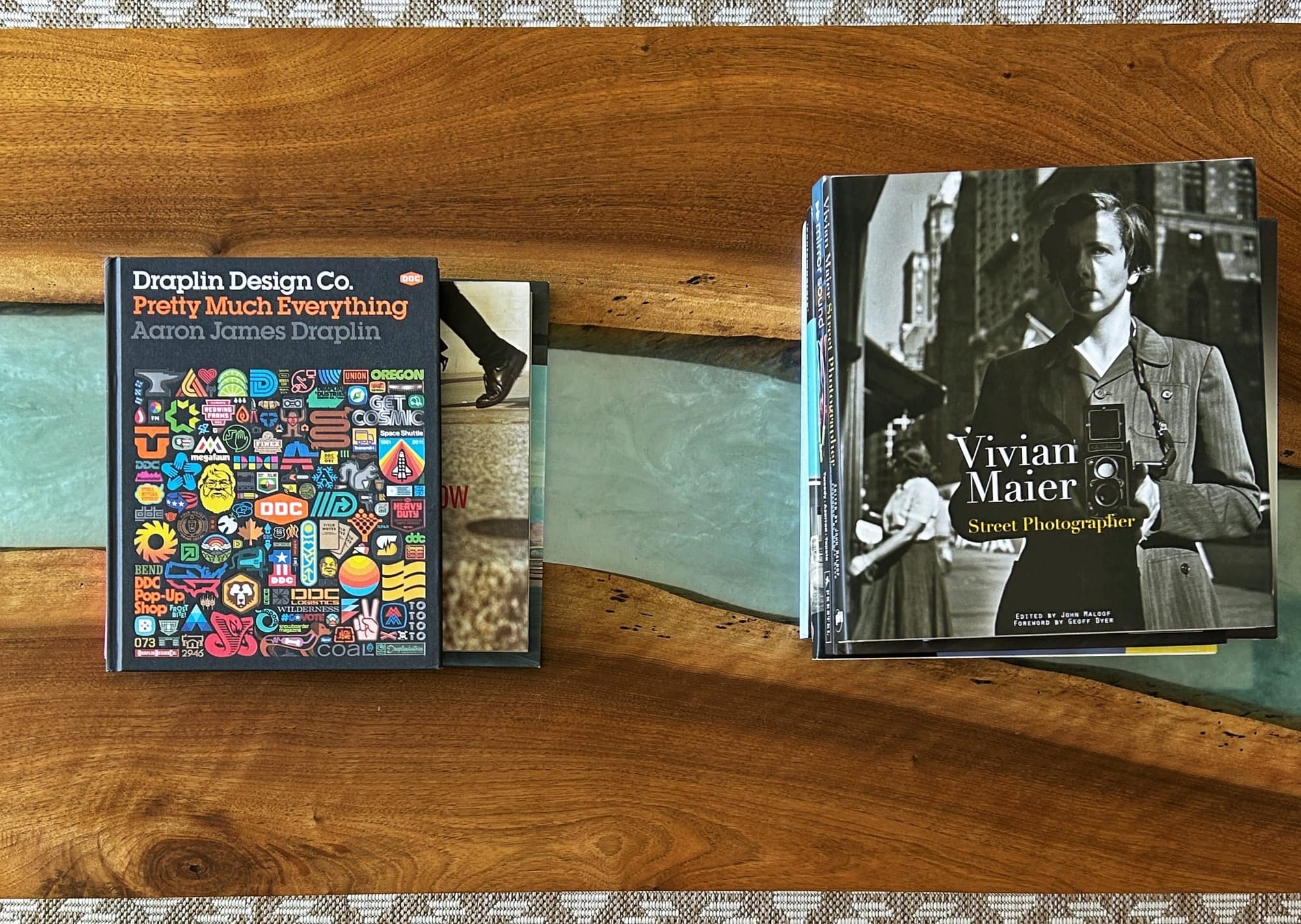 A photo of coffee table books on a coffee table