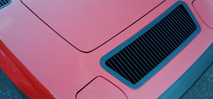 A photo of simple details on a sports car grill