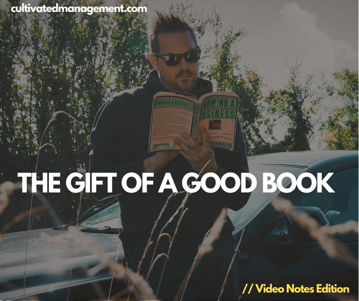 A photo of Rob Lambert reading the book Growing a Business with the words overlaid - the gift of a good boo