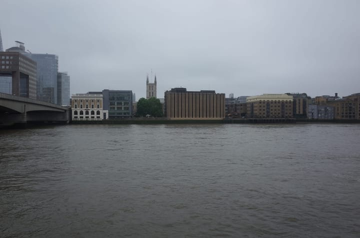A photo of the River Thames with office buildings lining the sides
