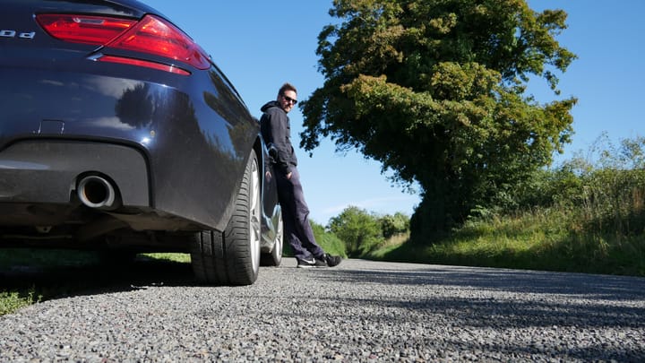 A photo of Rob Lambert by a BMW 6 Series