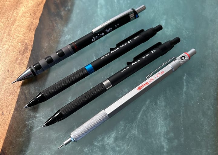 A photo of mechanical pencils laid out on the desk