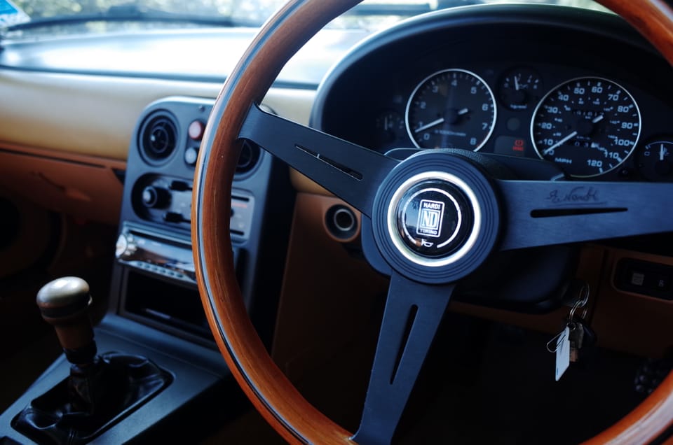 A photo of the inside of a Mazda MX5 Mk1