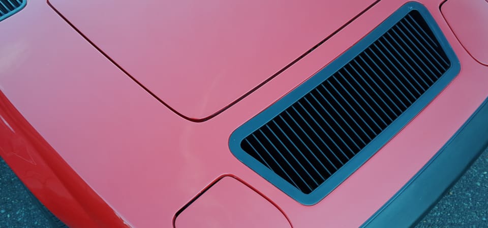 A photo of simple details on a sports car grill