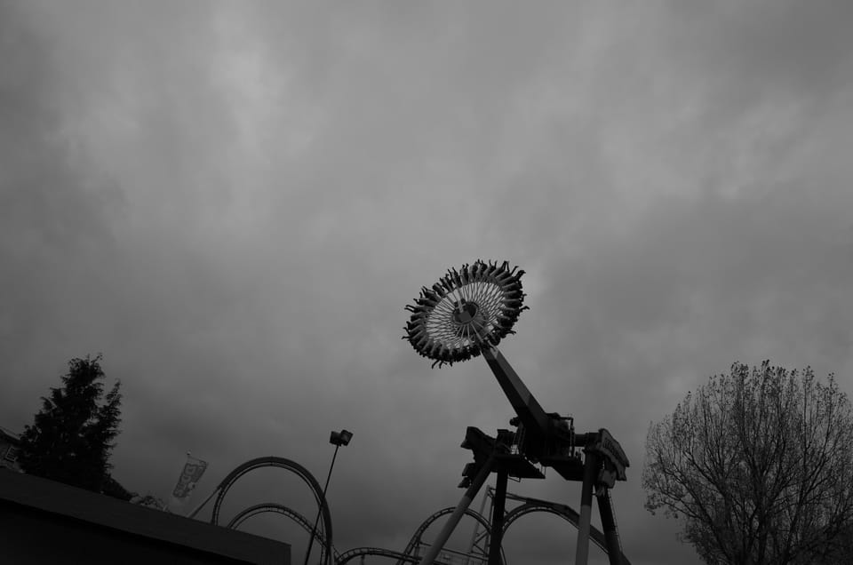 Some people on a scary ride at the fairground