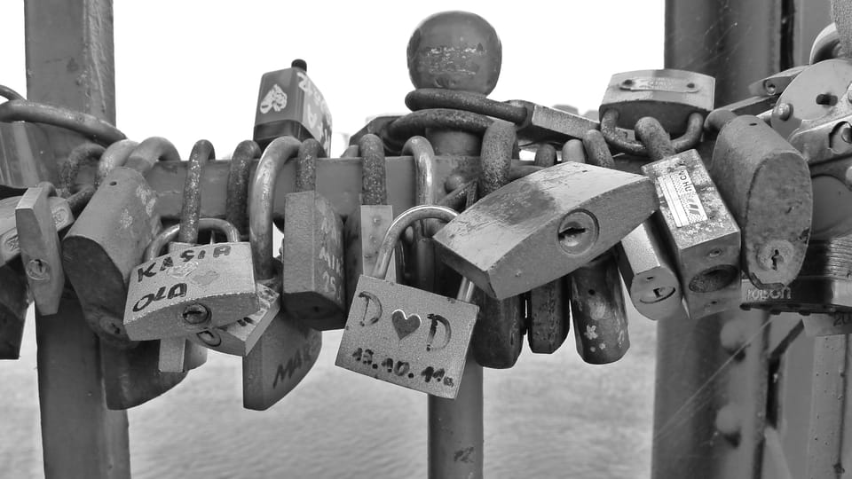 A photo of padlocks with names on them in Poland