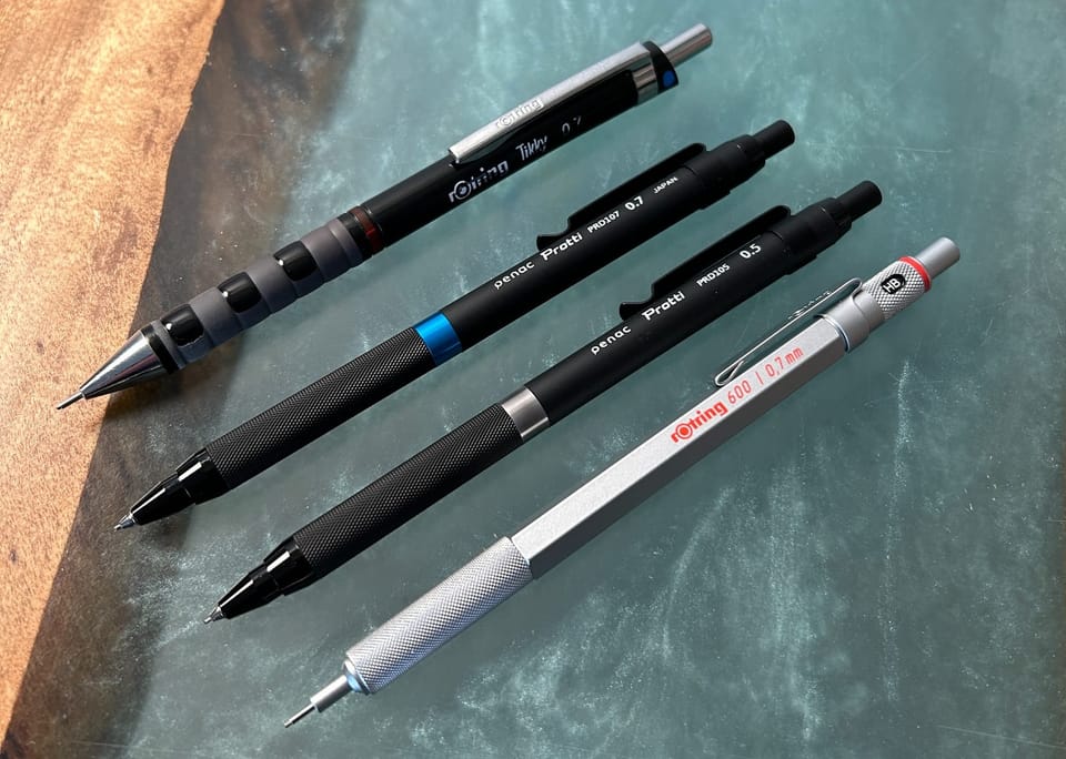 A photo of mechanical pencils laid out on the desk